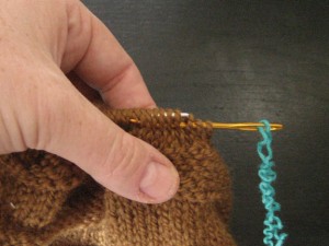 transfer the stitches onto scrap yarn step 1