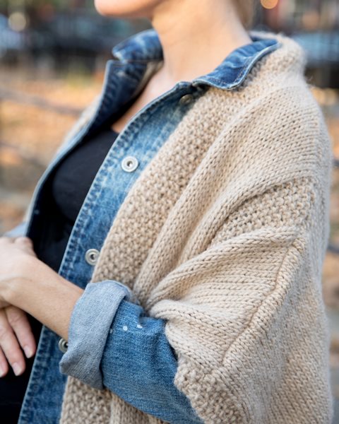 View from the side of a woman wear a cardigan